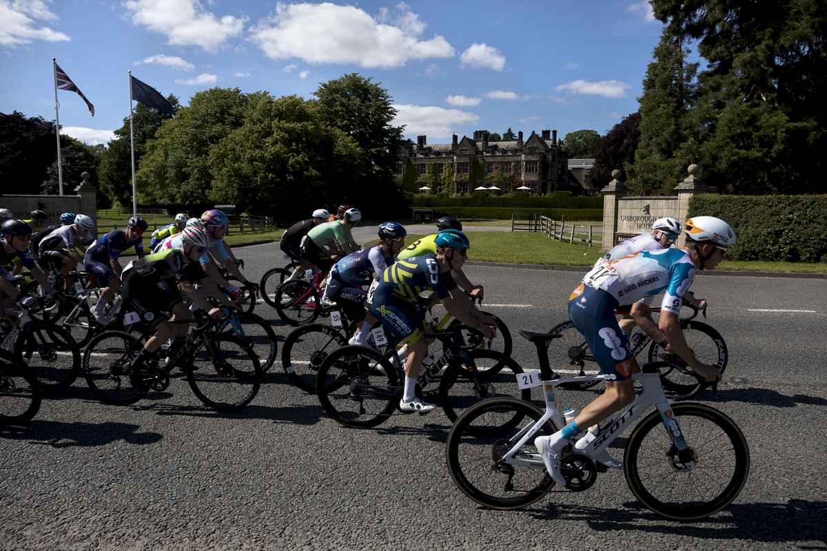 British National Road Championships 2024 - Men’s Road Race -The peloton passes by the front of Gisborough Hall