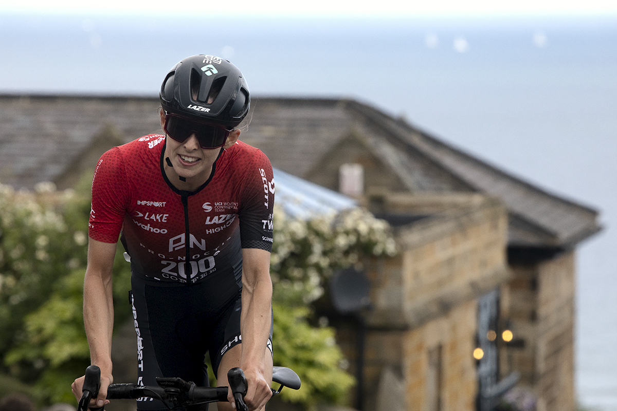 British National Road Championships 2024 - Women’s Road Race - Maddie Heywood stands on her pedals as she tackles the climb in Saltburn