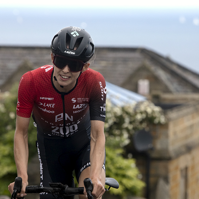 British National Road Championships 2024 - Women’s Road Race - Maddie Heywood stands on her pedals as she tackles the climb in Saltburn