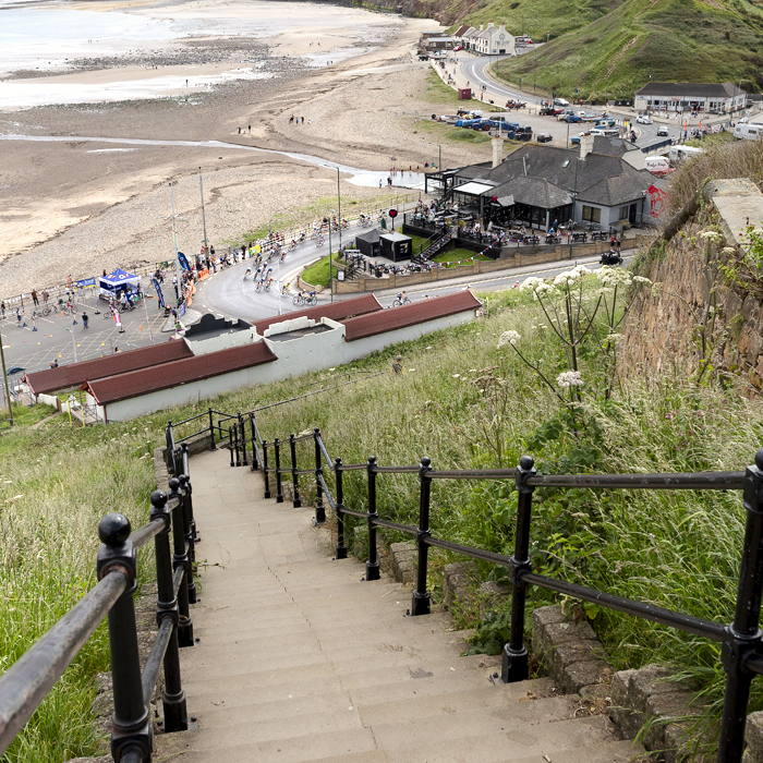 British National Road Championships 2024 - Women’s Road Race - The race passes down the sea front as seen from the top of steep steps