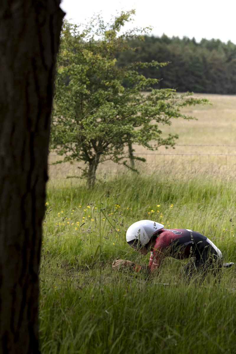 British National Road Championships 2024 -  Men’s Time Trial - Finlay Graham visible above long grass during the event near Catterick Garrison