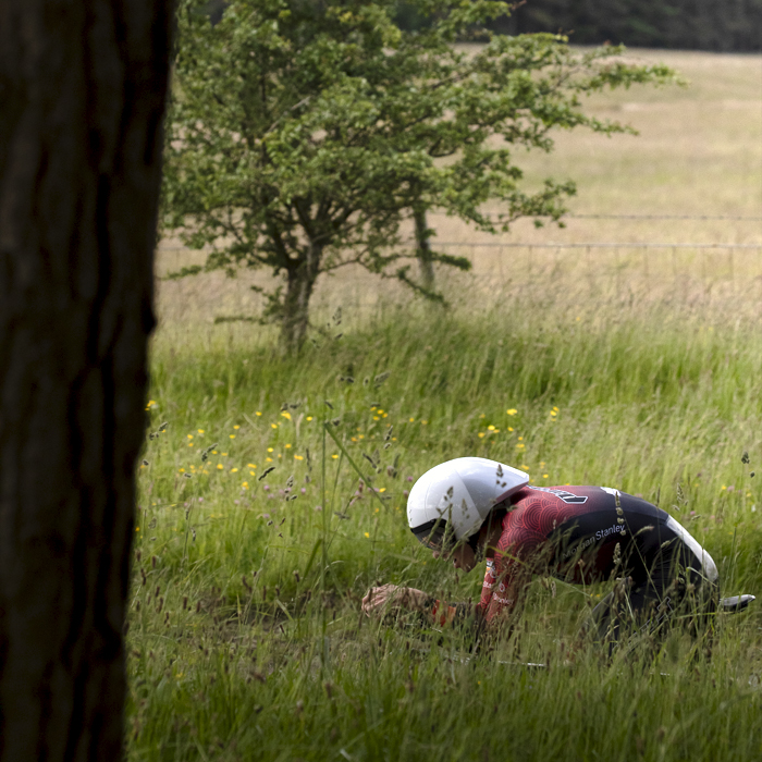 British National Road Championships 2024 -  Men’s Time Trial - Finlay Graham visible above long grass during the event near Catterick Garrison