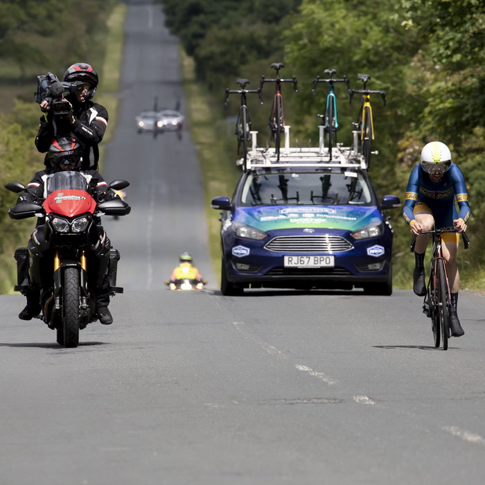 British National Road Championships 2024 -  Men’s Time Trial - Paul Burton is followed by his team car and the video Moto