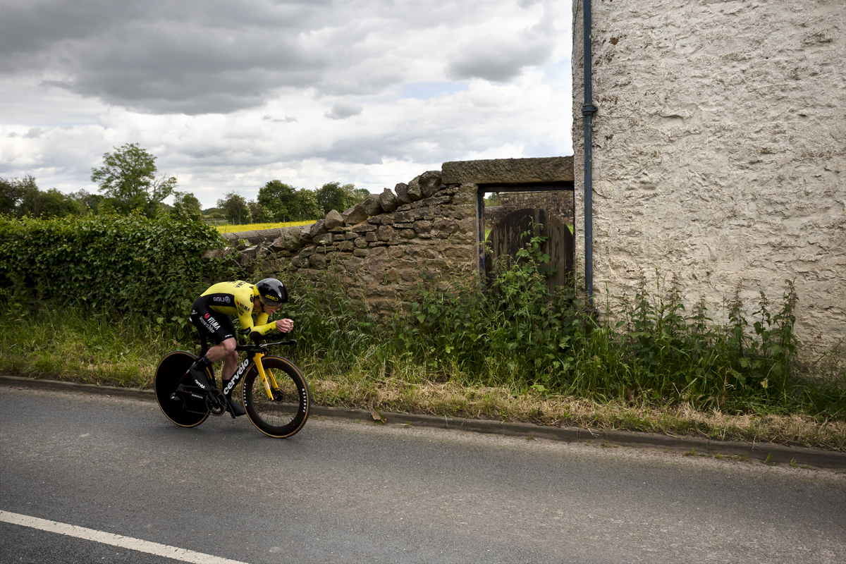 British National Road Championships 2024 - Men’s U23 Time Trial -Matthew Brennan of Visma Lease-a-Bike Development team passes by stone farm buildings