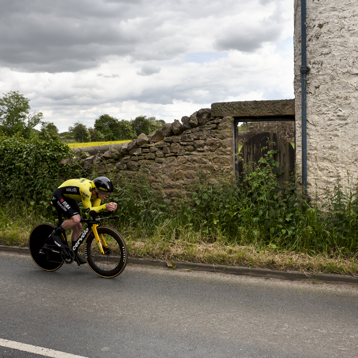 British National Road Championships 2024 - Men’s U23 Time Trial -Matthew Brennan of Visma Lease-a-Bike Development team passes by stone farm buildings