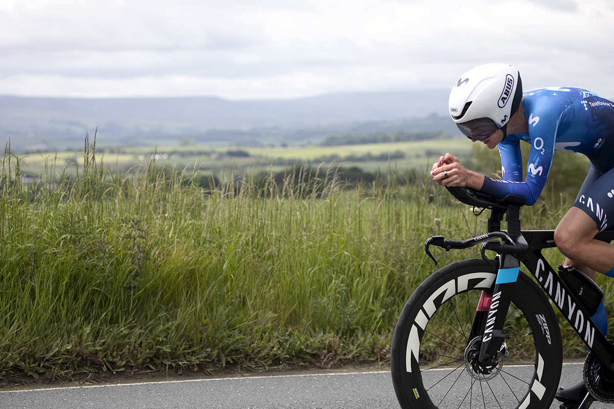 British National Road Championships 2024 -  Women’s Time Trial - Claire Steels cycles into frame with the Yorkshire Dales in the distance