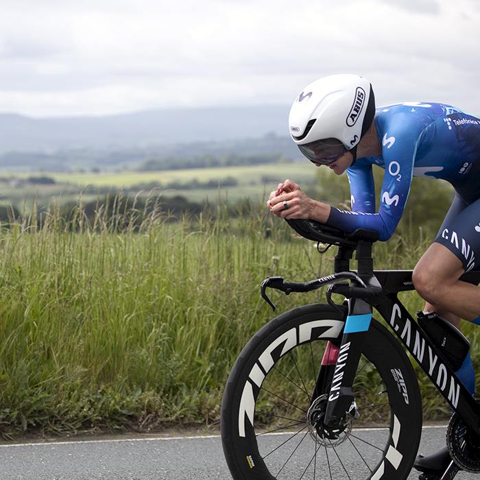 British National Road Championships 2024 -  Women’s Time Trial - Claire Steels cycles into frame with the Yorkshire Dales in the distance