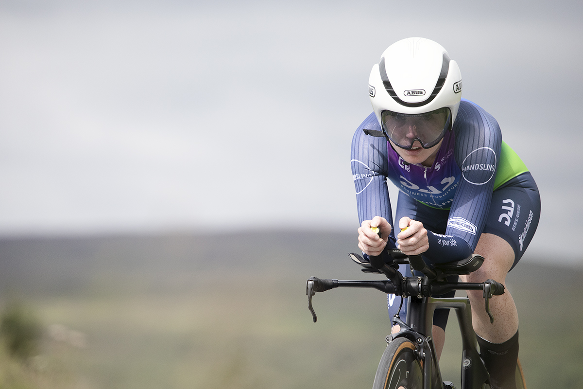 British National Road Championships 2024 -  Women’s Time Trial - Lucy Lee tackles a climb with open countryside behind her