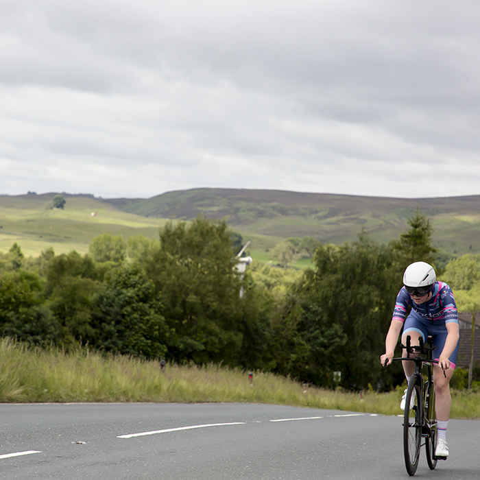 British National Road Championships 2024 - Women’s U23 Time Trial - Isabella Johnson tackles one of the hills on the course with the Yorkshire Dales behind her