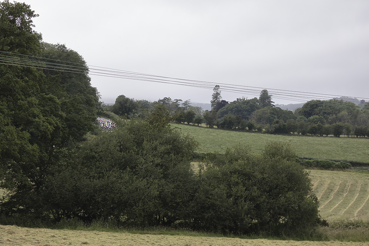British National Road Championships 2025 - Road Race - Men - the race seen from a distance tackling a short climb outside Abermad