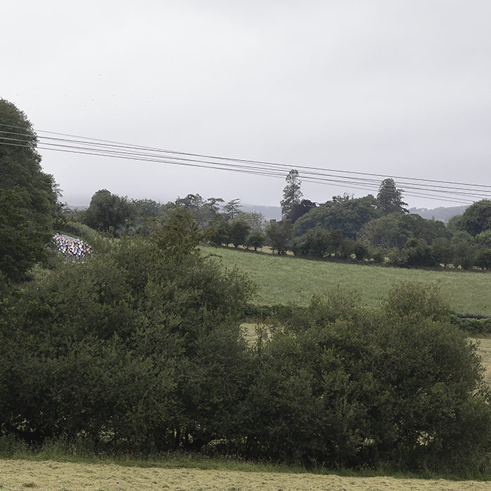 British National Road Championships 2025 - Road Race - Men - the race seen from a distance tackling a short climb outside Abermad
