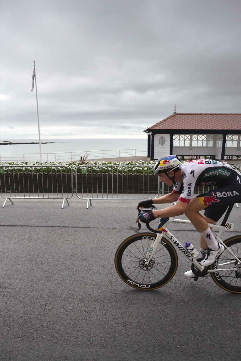 British National Road Championships 2025 - Road Race - Men - Callum Thornley of Red Bull - BORA - hansgrohe Rookies races past a seafront shelter