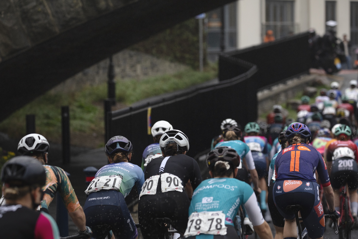 British National Road Championships 2025 - Road Race - Women - Aberystwyth - rear view of the riders with a set of railings snaking away to their left