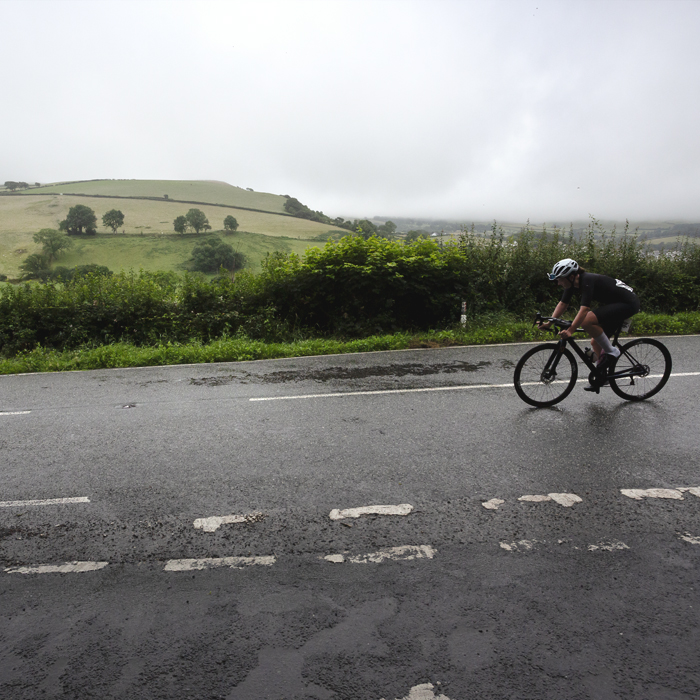 British National Road Championships 2025 - Road Race - Women - Lowri Richards from the side with rolling Welsh hills as a backdrop