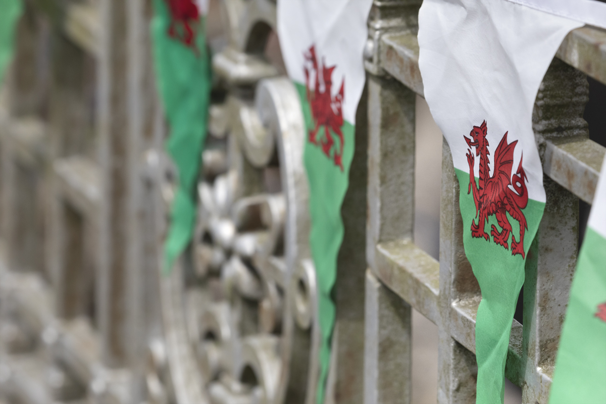 British National Road Championships 2025 - Time Trial - U23 Women - Bunting bearing a Welsh flag on a wall