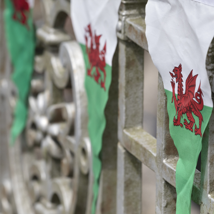 British National Road Championships 2025 - Time Trial - U23 Women - Bunting bearing a Welsh flag on a wall