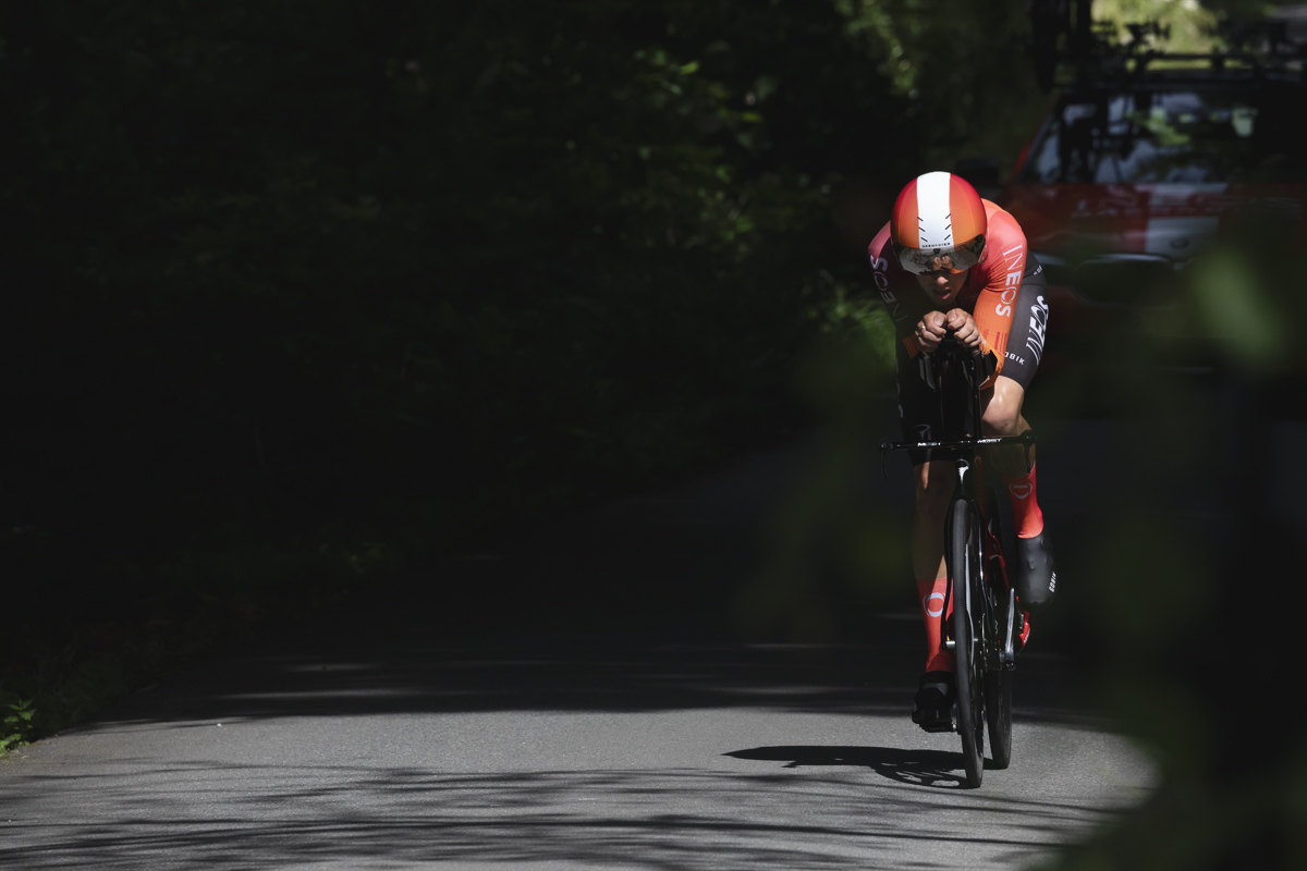 British National Road Championships 2025 - Time Trial - Elite Men - Sam Watson of Ineos Grenadiers enters a pool of light on the road