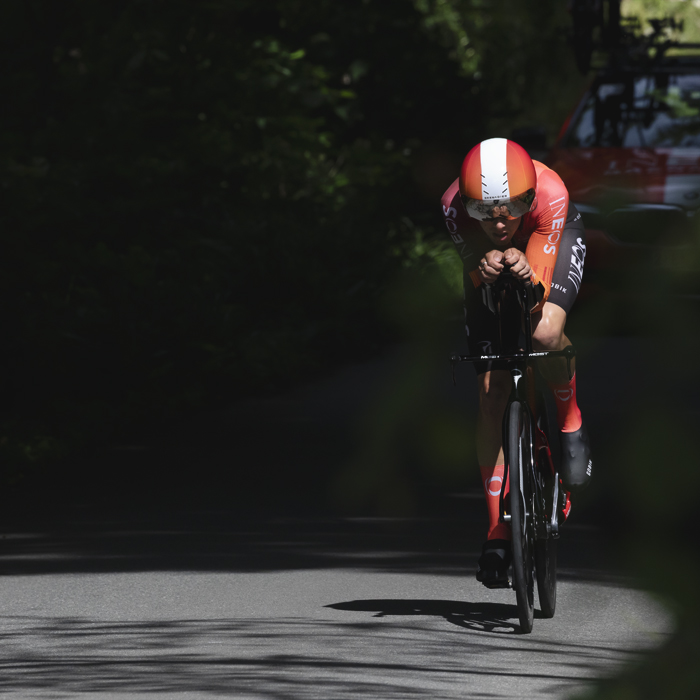 British National Road Championships 2025 - Time Trial - Elite Men - Sam Watson of Ineos Grenadiers enters a pool of light on the road