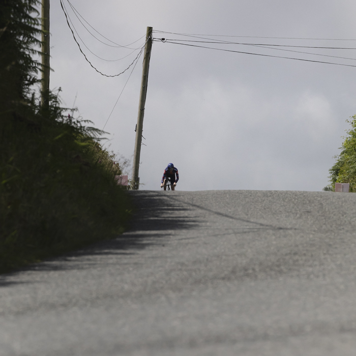 British National Road Championships 2025 - Time Trial - Elite Women - Josie Nelson crests a hill in the distance