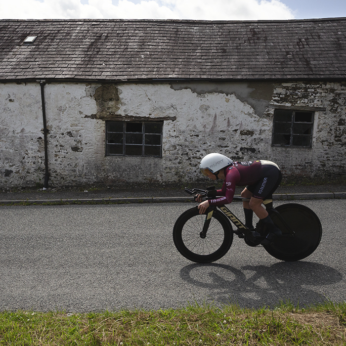 British National Road Championships 2025 - Time Trial - Elite Women - Laura Davies of FTP-Fulfil The Potential-Racing passes in front of a dilapidated barn