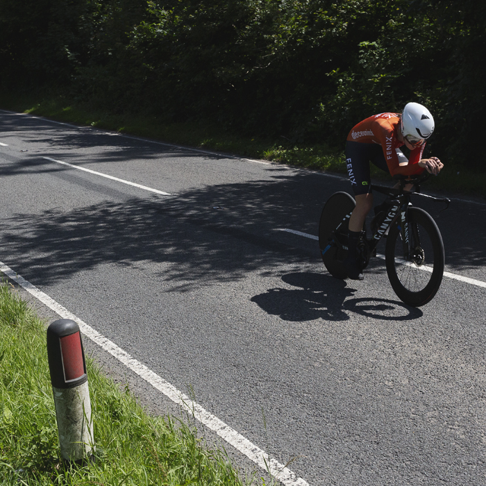 British National Road Championships 2025 - Time Trial - U23 Women - Millie Couzens of Fenix-Deceuninck rides through patches of light on the road