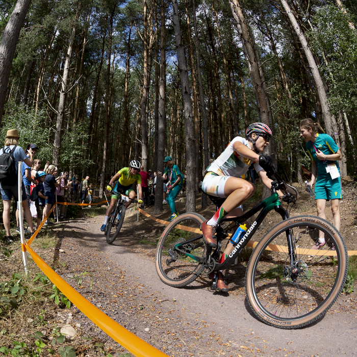 Birmingham 2022 - XXII Commonwealth Games - Mountain Bike - Women - Candice Lill of  South Africa races past stewards in their uniforms