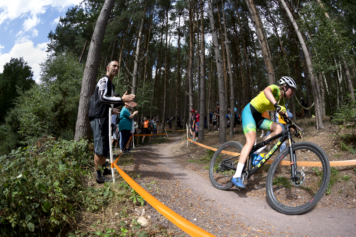 Birmingham 2022 - XXII Commonwealth Games - Mountain Bike - Women - Zoe Cuthbert of Australia is applauded by fans as she races in Cannock Chase