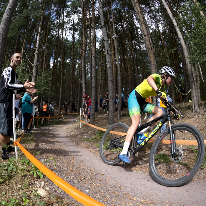 Birmingham 2022 - XXII Commonwealth Games - Mountain Bike - Women - Zoe Cuthbert of Australia is applauded by fans as she races in Cannock Chase