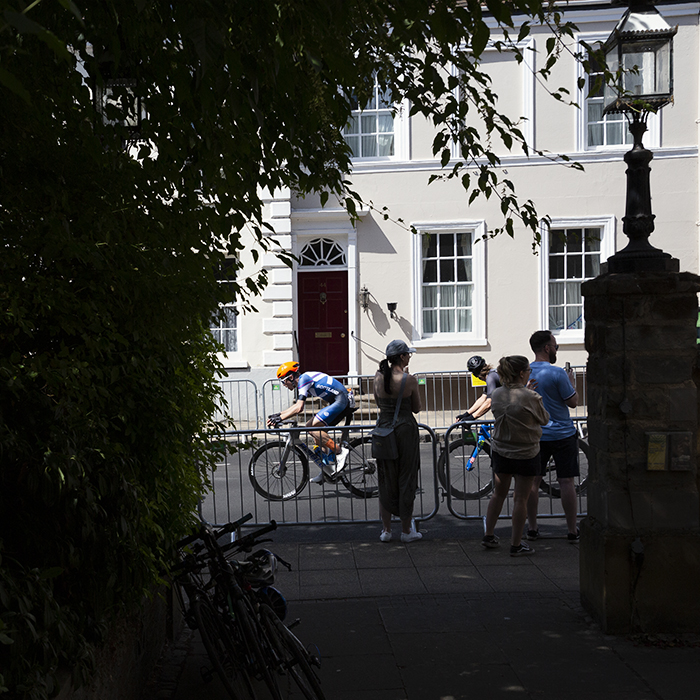 Birmingham 2022 - XXII Commonwealth Games - Men’s Road Race - Finn Crockett of Scotland seen from the yard of Warwick Unitarian Church