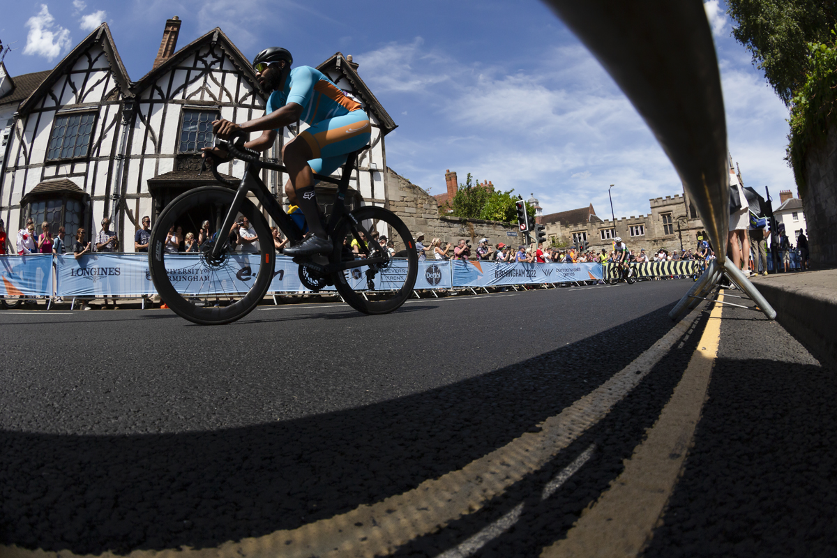 Birmingham 2022 - XXII Commonwealth Games - Men’s Road Race - Hasani Hennis of Anguilla races past a Tudor building