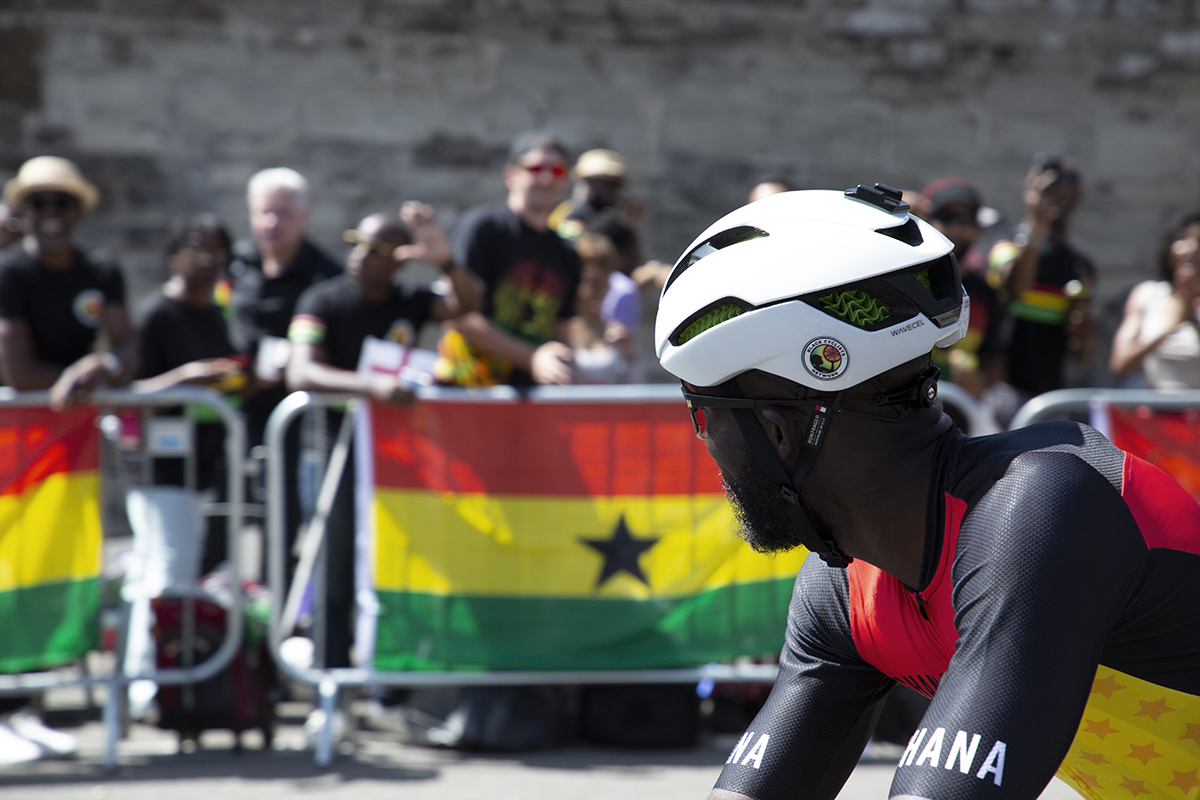 Birmingham 2022 - XXII Commonwealth Games - Men’s Road Race - Mani Arthur of Ghana looks across at some of his supporters