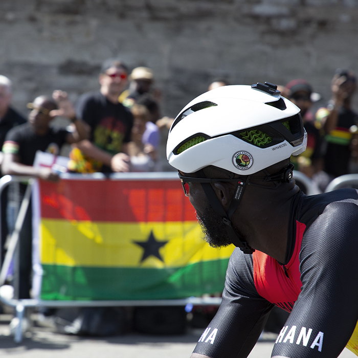 Birmingham 2022 - XXII Commonwealth Games - Men’s Road Race - Mani Arthur of Ghana looks across at some of his supporters