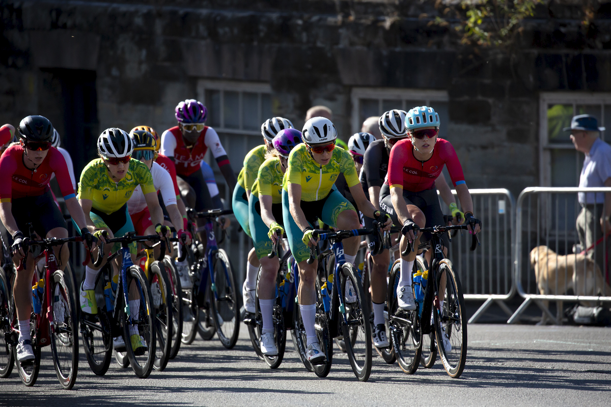 Birmingham 2022 - XXII Commonwealth Games -Women’s Road Race -The peloton rides through streets of Warwick led by the Australian team