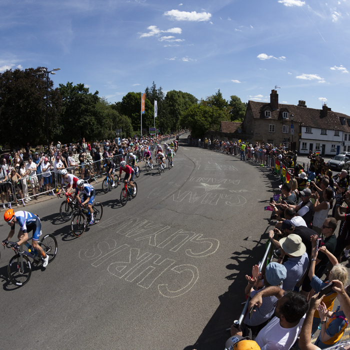 Birmingham 2022 - XXII Commonwealth Games - Men’s Road Race - Large crowds line the road as the race corners near the castle