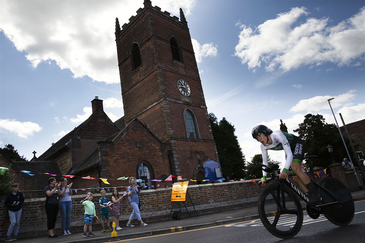 Birmingham 2022 - XXII Commonwealth Games - Women’s Time Trial - Joanna Paterson of Ireland rides past a church as fans look on