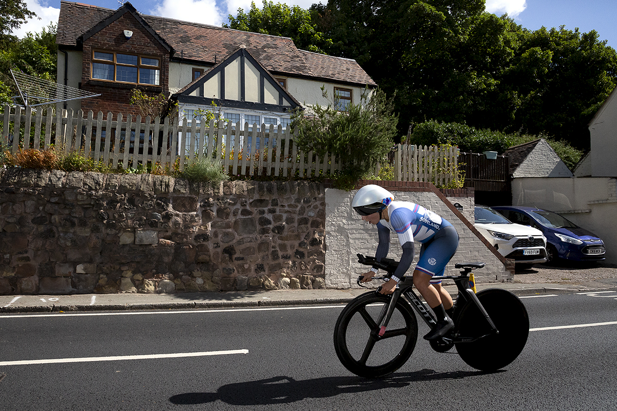 Birmingham 2022 -XXII Commonwealth Games - Women’s Time Trial - Neah Evans from Scotland passes a suburban house during the competition