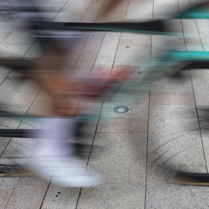 Coppa Bernocchi 2024 - A bike speeds by on the piazza of Legnano