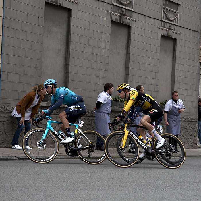 Dwars Door Vlaanderen 2022 - Victor Campanaerts of Lotto Soudal, Pascal Eenkhoorn of Jumbo-Visma and Astana Qazaqstan Team’s Davide Martinelli race through the streets