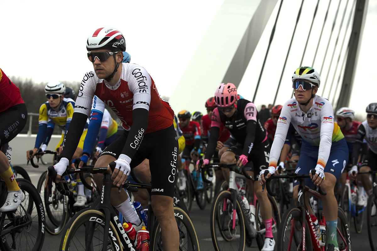 Dwars Door Vlaanderen 2023 - Wesley Kreder of Cofidis in the peloton crosses the Munkenbrug