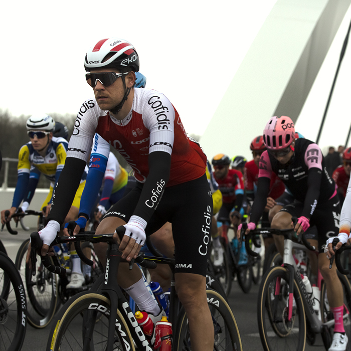 Dwars Door Vlaanderen 2023 - Wesley Kreder of Cofidis in the peloton crosses the Munkenbrug