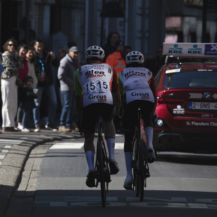 Dwars Door Vlaanderen 2025 - Hugo Page and Biniam Girmay follow the Race Director’s car during the neutralised start in Roselare
