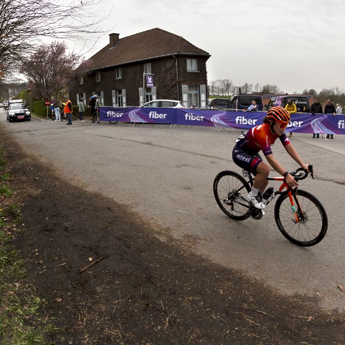 Dwars Door Vlaanderen Vrouwen 2023 - Human Powered Health rider Makayla MacPherson passes the top of Ronde van Vlaanderenstraat