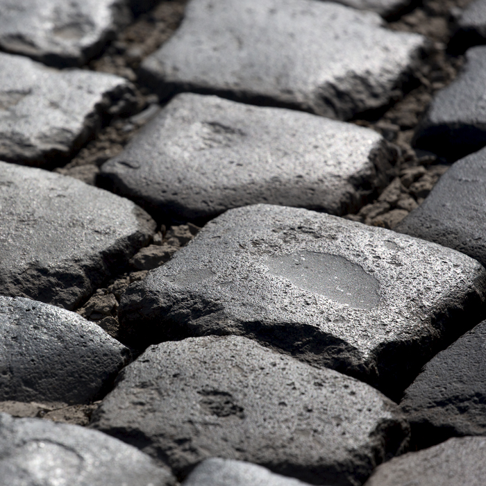 E3 Saxo Bank Classic 2022 - A close up of the rough cobbles on Holleweg glinting in the low sunlight