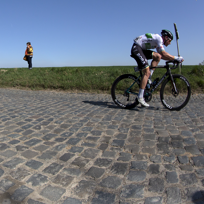 E3 Saxo Bank Classic 2022 - Ryan Mullen of Bora-hansgrobe wearing his Irish Champions jersey leads riders past fans on Holleweg