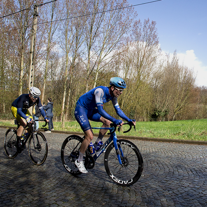 E3 Saxo Classic 2023 - Elmar Reinders from Jayco Alula and Gilles De Wilde from Team Flanders-Baloise ride up the cobbles