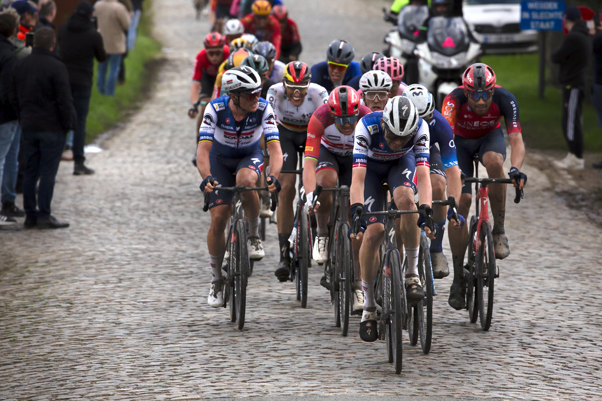 E3 Saxo Classic 2023 - Kasper Asgreen of Soudal Quick-Step with his head down in effort with a group of riders at the top of Mariaborrestraat