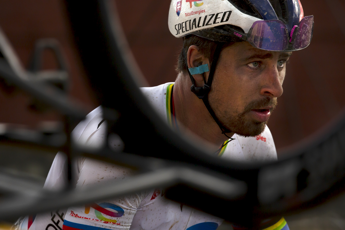 E3 Saxo Classic 2023 - Peter Sagan of TotalEnergies framed through a bike wheel