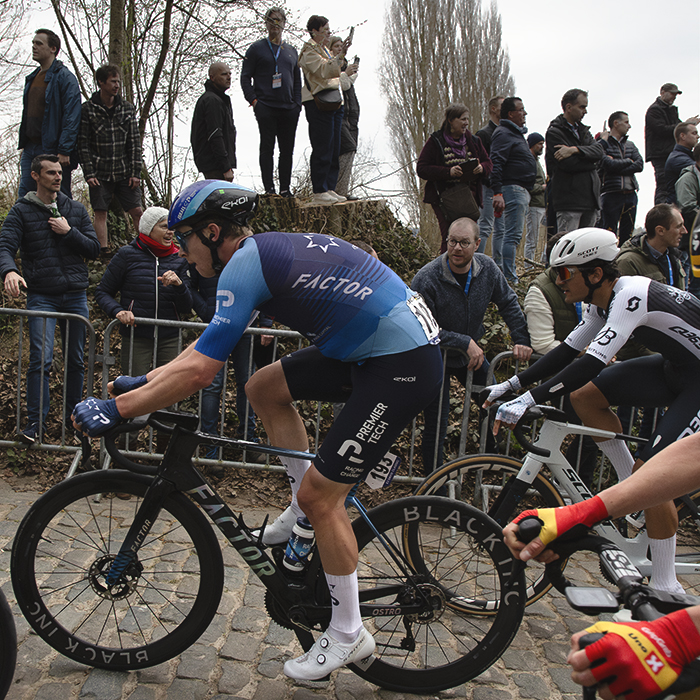E3 Saxo Classic 2025 - Matis Louvel in a group of riders is watched by fans on the high banks next to the road