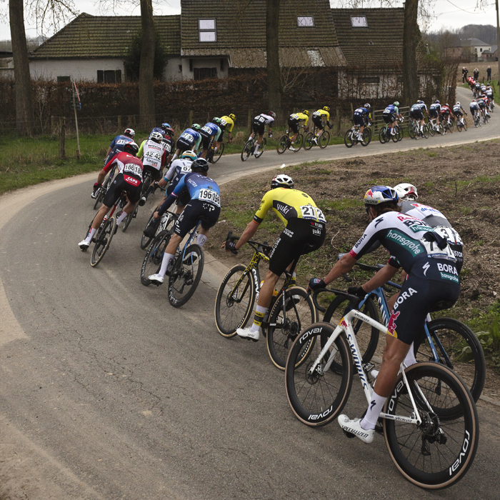 E3 Saxo Classic 2025 - Riders snake along the road at Terpoort