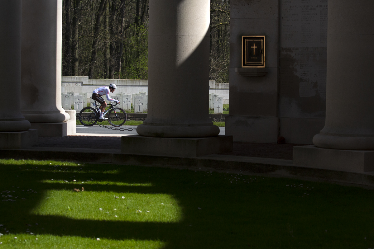 Gent - Wevelgem 2022 - Greg van Avermaet, riding for AG2R Citroën Team is framed by the pillars of the Memorial to the Missing at Ploegstraat